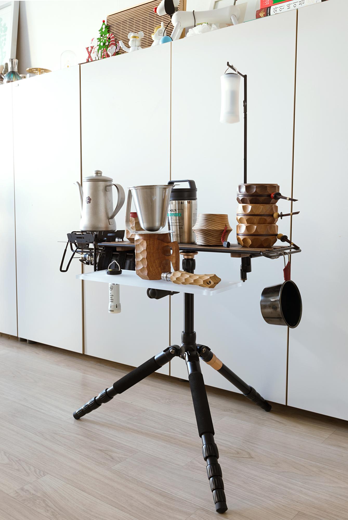 Small studio kitchen with warm lighting and tools