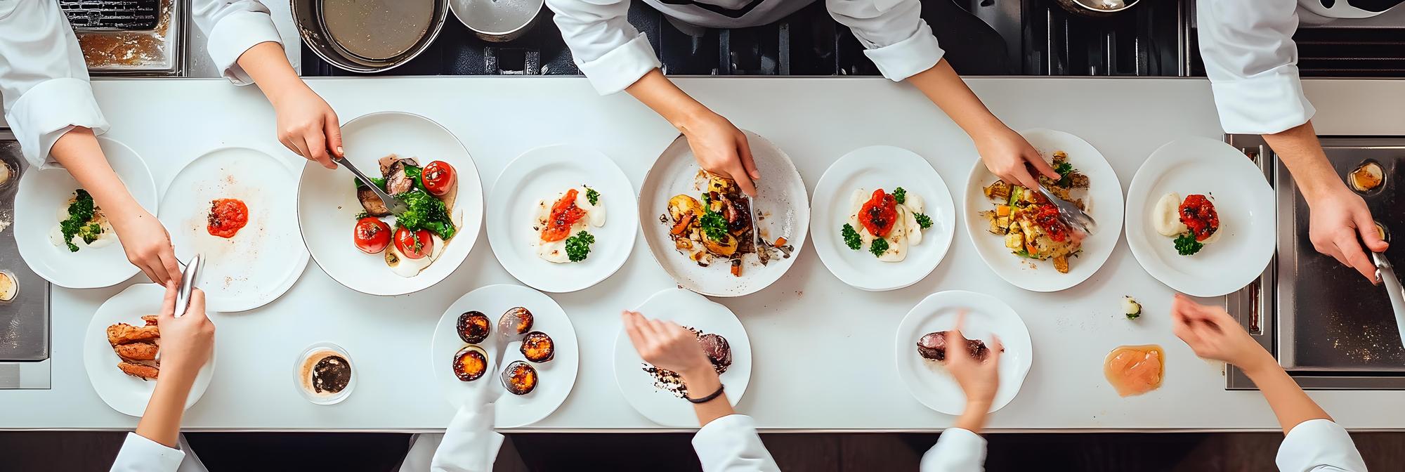 Students tasting dishes at a long table